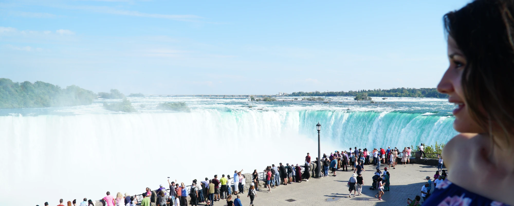 tour guest looking over Niagara Falls