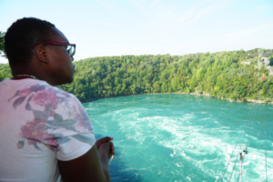 tour guest looking at the whirlpool rapids